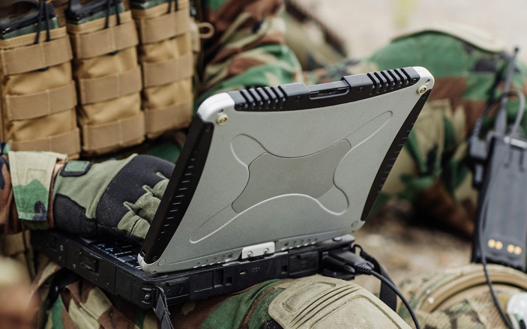 soldiers holding gps in hand and determines the location of coor